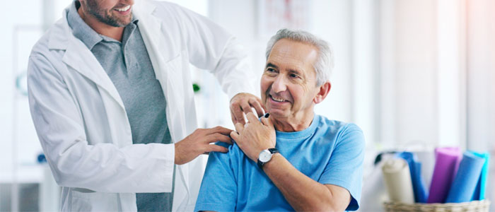 Doc with hand on patients shoulder